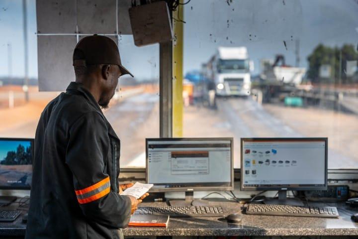 Mining trucks at an automated weighbridge